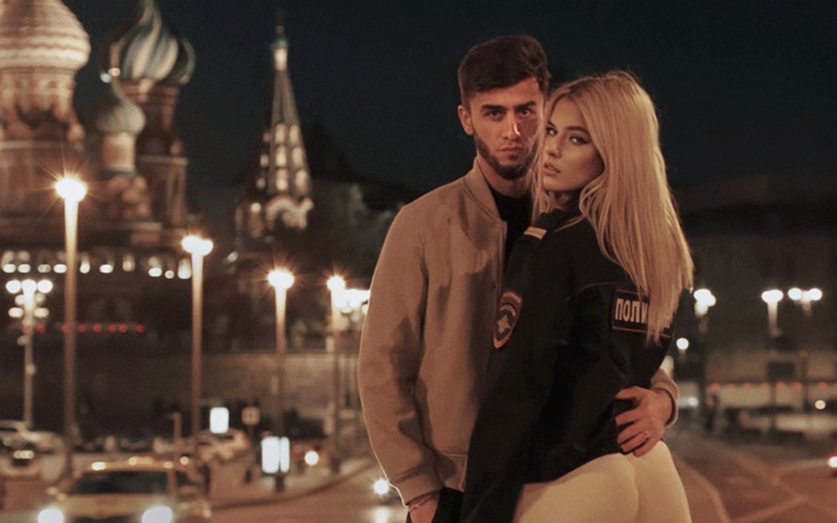 Tajik blogger says sorry after raunchy snaps with blonde ‘police woman’ outside Moscow cathedral outrage Russians